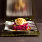 Coquilles op gemarineerde rodekool