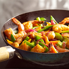 Thaise roerbak met grote garnalen en sugarsnaps