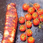 Gegrilde varkenshaas in bacon met kerstomaatjes