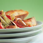 Warme venkelsalade met tomaat en amandelen