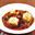 Coq au vin met kruidige knoedels