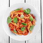 Romige macaroni met kaas en zongedroogde tomaten