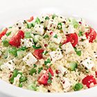 Couscous salade met kerstomaatjes en lente-ui