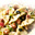 Farfalle met courgette, bosuitjes, paprika en salami