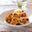 Tomatenrisotto met kastanjechampignons en courgette