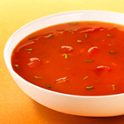 Tomatensoep met maïs en ham