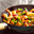 Thaise roerbak met grote garnalen en sugarsnaps