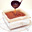 Wortelcake met walnoten, sultana's, kokos en citrussiroop