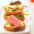 Crostini met tomaat, ham en courgette
