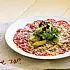 Carpaccio van hertenfilet, rucola en gebakken appel