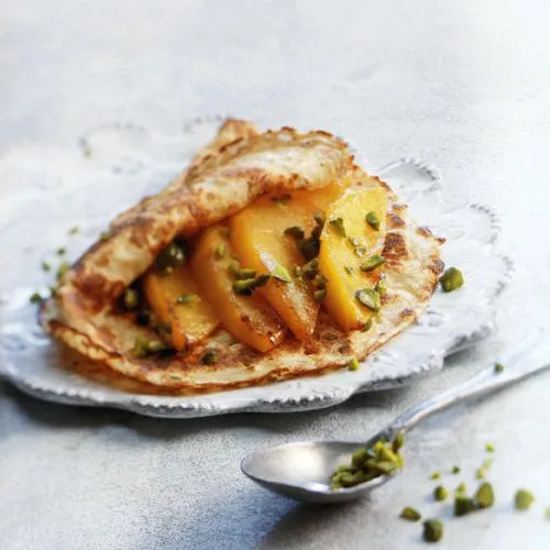 Crêpes met in rum geflambeerde mango