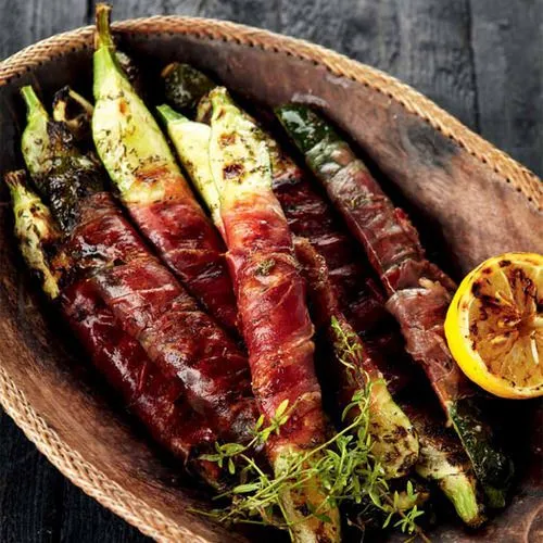 Courgettes met prosciutto crudo