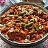 Geroosterde paprika met noten, chili en komijn
