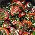 Tomatensalade met lente-uitjes en komkommer