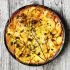 Aardappeltaart met gezouten vis, room en marjolein
