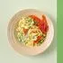 Tagliatelle met tuinbonen, krokante prosciutto en Parmezaanse kaas