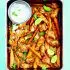 Pittige Chipotle-kippenvleugels met zoete aardappel en limoenyoghurt