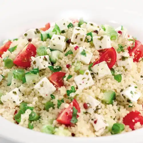 Couscous salade met kerstomaatjes en lente-ui