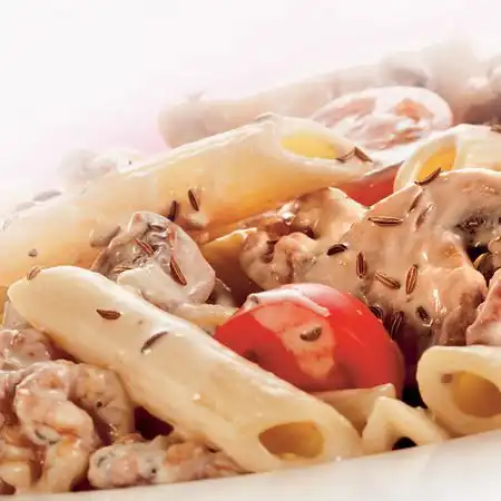 Penne met gemengde paddenstoelen en kerstomaatjes